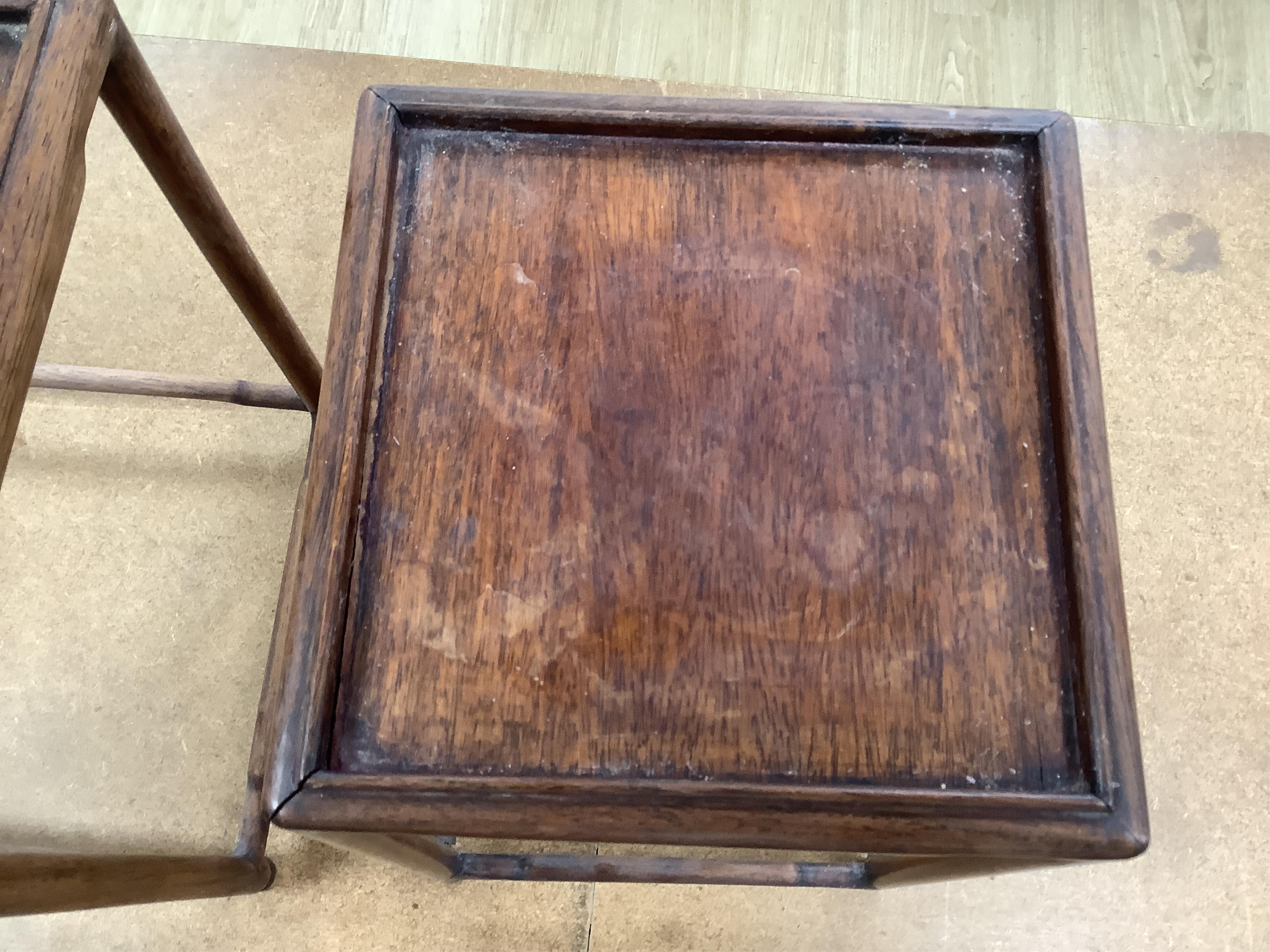 A nest of five Chinese hardwood stands, tallest (largest) 32cm high